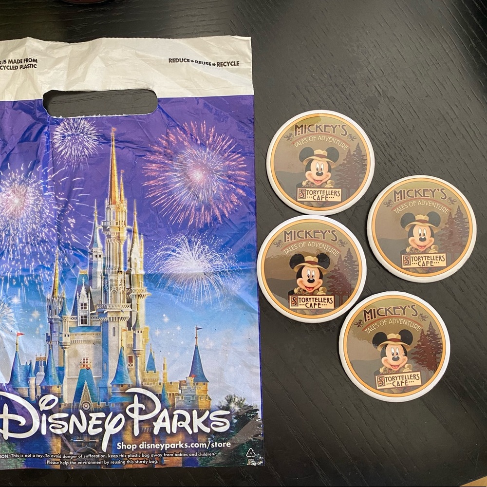 4 Storytellers Cafe lapel pin buttons and Disney Parks bag